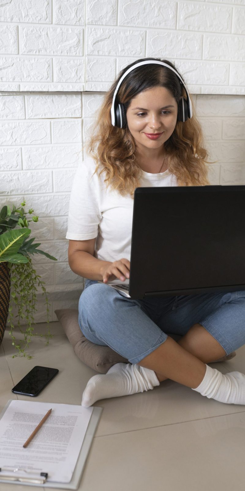 full-shot-woman-working-with-laptop